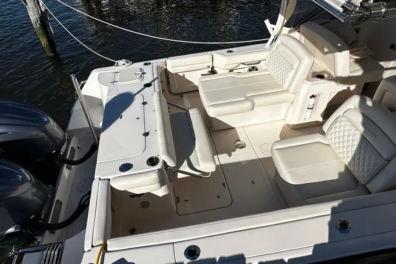  Yacht Photos Pics 2023 Grady-White Freedom 307 boat interior with luxurious seating and dual engines.