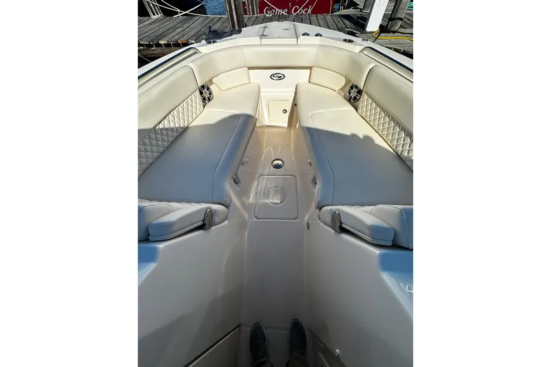  Yacht Photos Pics 2023 Grady-White Freedom 307 boat interior with cushioned seating and sleek design.