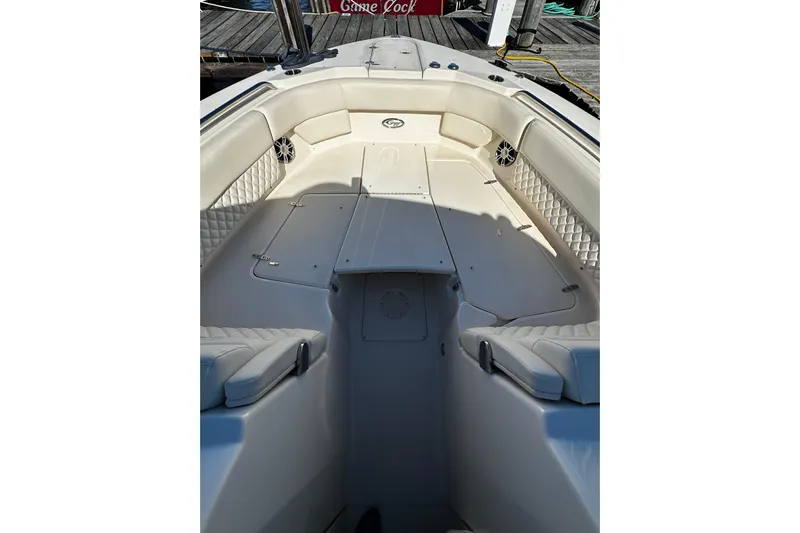  Yacht Photos Pics 2023 Grady-White Freedom 307 boat interior with cushioned seating and storage compartments.