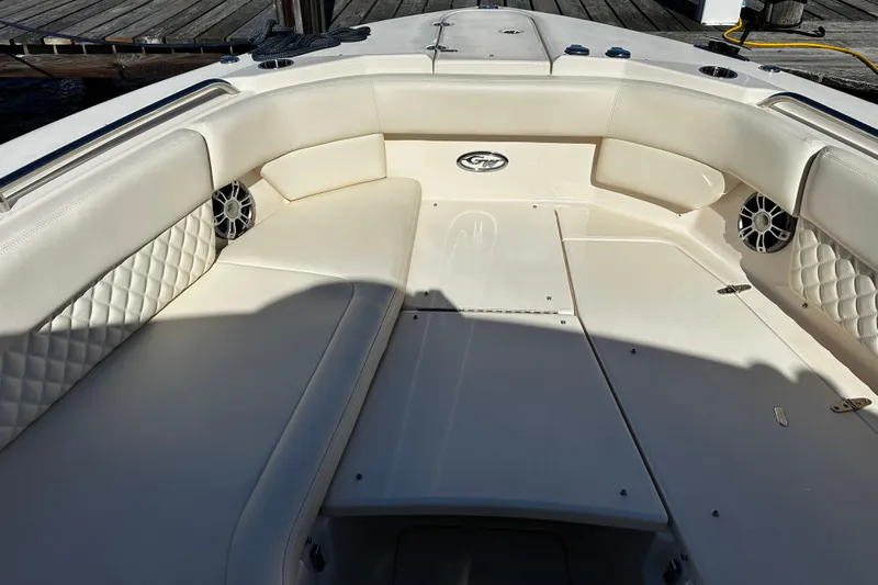  Yacht Photos Pics 2023 Grady-White Freedom 307 boat interior with cushioned seating and speakers.
