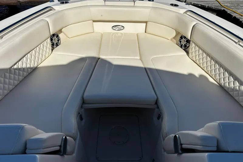  Yacht Photos Pics Luxurious seating area on 2023 Grady-White Freedom 307 boat, featuring elegant white upholstery.