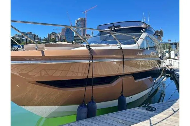  Yacht Photos Pics 2025 Sessa Marine F47 yacht docked at marina with city skyline in background.