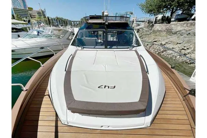  Yacht Photos Pics 2025 Sessa Marine F47 yacht docked, showcasing sleek design and spacious deck.