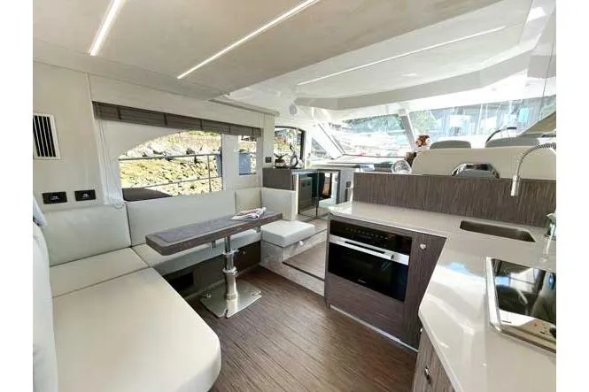  Yacht Photos Pics Luxurious interior of 2025 Sessa Marine F47 yacht with modern kitchen and seating area.