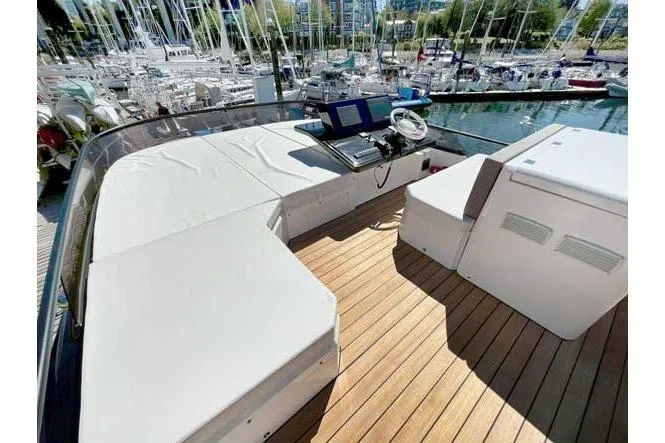  Yacht Photos Pics 2025 Sessa Marine F47 yacht deck with helm, docked in marina.