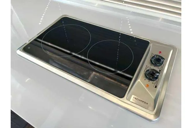  Yacht Photos Pics Modern electric cooktop with dual burners on Sessa Marine F47 yacht, 2025 model.