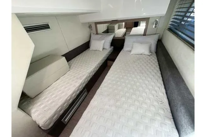  Yacht Photos Pics 2025 Sessa Marine F47 yacht cabin with twin beds and modern decor.
