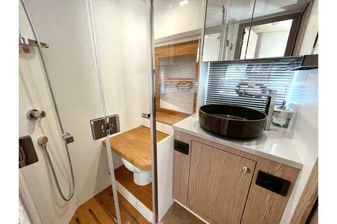  Yacht Photos Pics Modern bathroom in 2025 Sessa Marine F47 yacht with sleek fixtures and wooden accents.