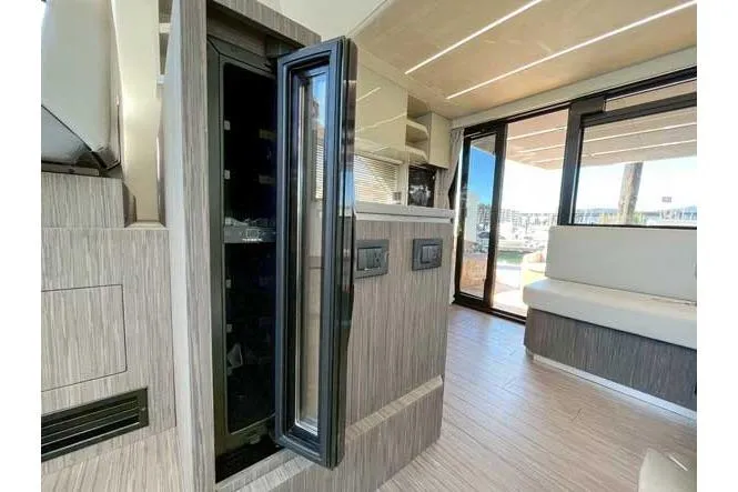  Yacht Photos Pics Interior of 2025 Sessa Marine F47 yacht, featuring modern design and spacious seating area.