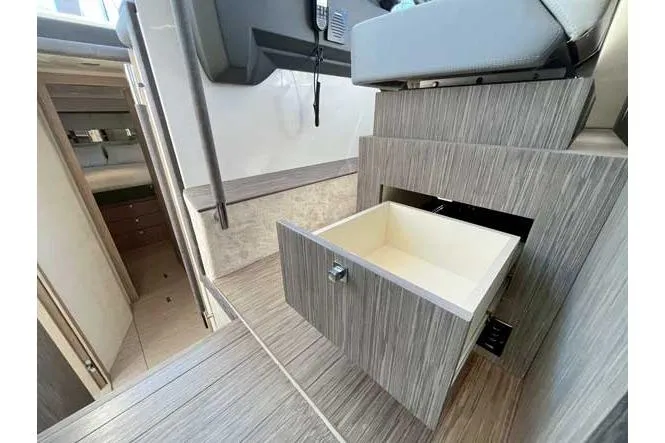  Yacht Photos Pics Interior of 2025 Sessa Marine F47 yacht with open storage drawer.