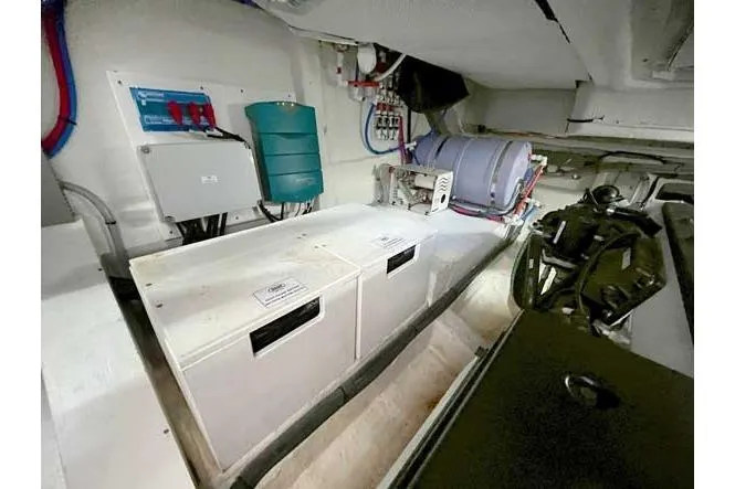  Yacht Photos Pics Engine room of 2025 Sessa Marine F47 yacht, showcasing equipment and storage compartments.