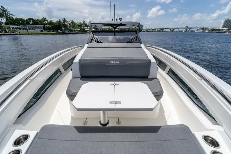  Yacht Photos Pics 2025 Limitless Seas XLV 45 luxury yacht interior with sleek seating and table on calm water.