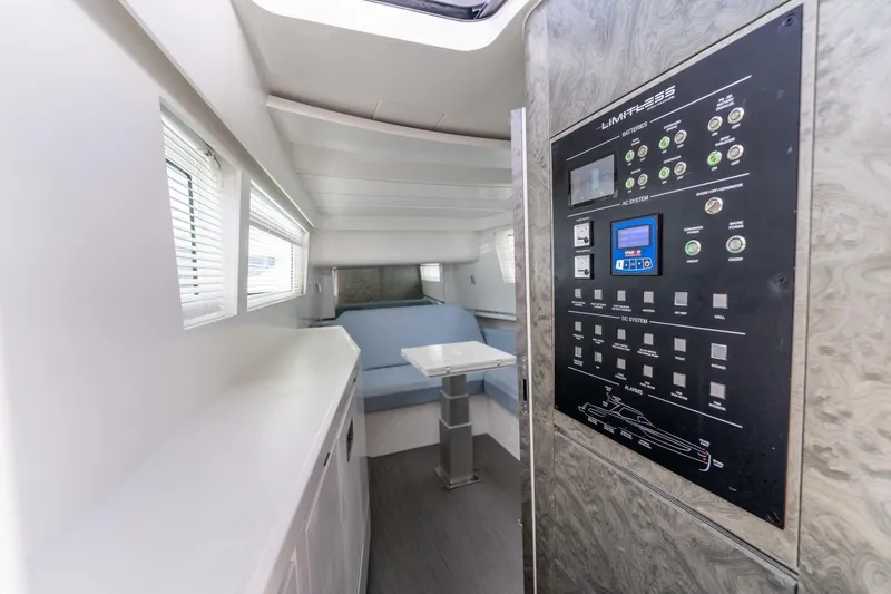  Yacht Photos Pics Interior of 2025 Limitless Seas XLV 45 yacht with control panel and seating area.