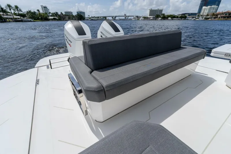  Yacht Photos Pics Luxury Limitless Seas XLV 45 boat with sleek seating, 2025 model, on a scenic waterfront.