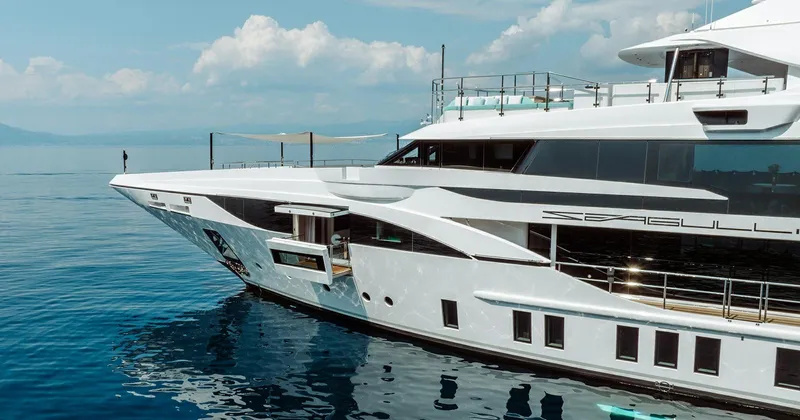  Yacht Photos Pics Luxury Benetti Seagull yacht, 2020 model, cruising on calm blue waters under a clear sky.