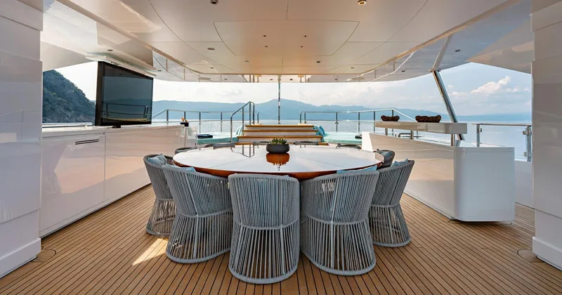  Yacht Photos Pics Luxurious Benetti Seagull 2020 yacht deck with elegant dining area and ocean view.