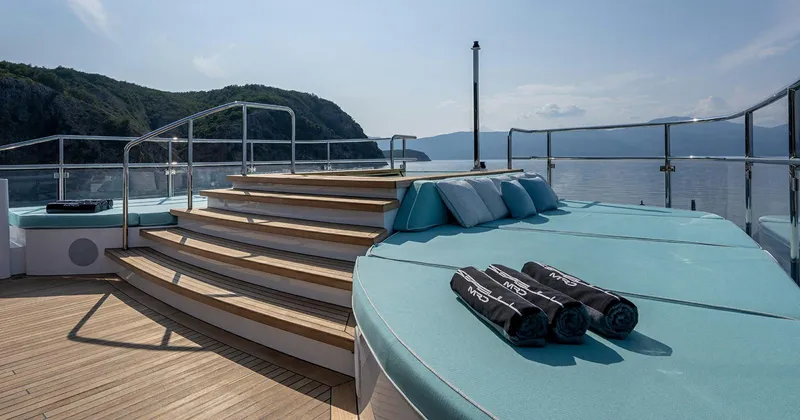  Yacht Photos Pics Luxurious 2020 Benetti Seagull yacht deck with sun loungers and scenic ocean view.