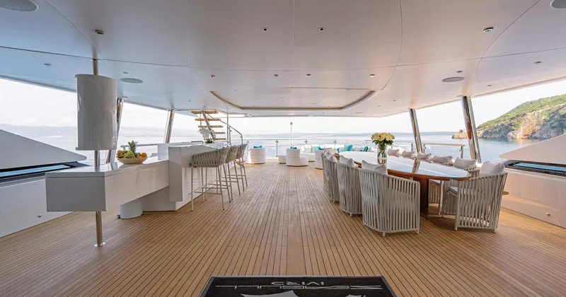 Yacht Photos Pics Luxurious Benetti Seagull yacht deck, 2020 model, featuring elegant dining and seating areas.