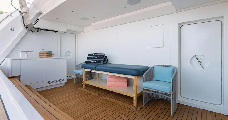  Yacht Photos Pics Luxurious Benetti Seagull 2020 yacht interior with massage table and seating area.