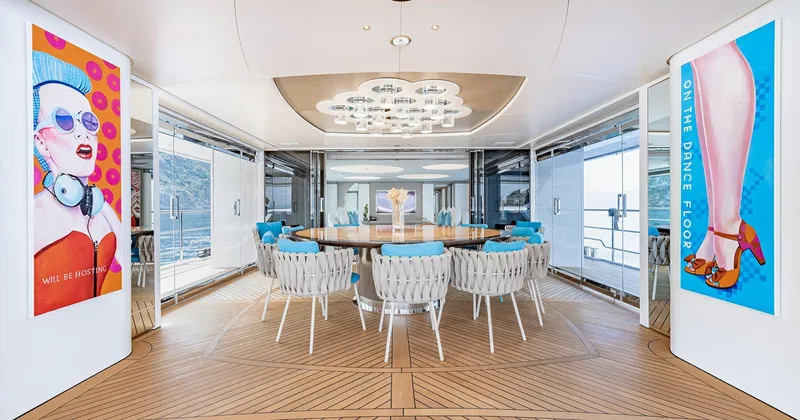  Yacht Photos Pics Luxurious Benetti Seagull yacht interior, 2020 model, featuring elegant dining area and modern art.