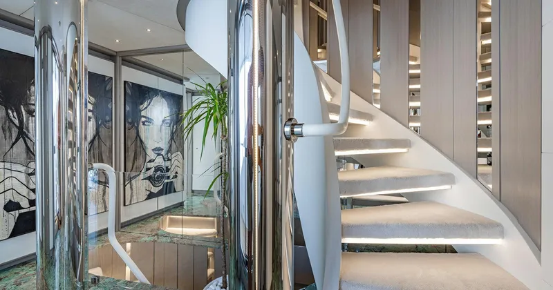  Yacht Photos Pics Luxurious interior of 2020 Benetti Seagull yacht with modern staircase and artwork.