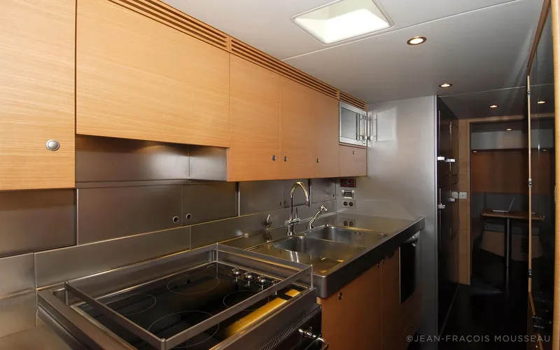 Whimsy Yacht Photos Pics Modern yacht kitchen with sleek cabinetry and stainless steel appliances, designed by Philippe Briand.