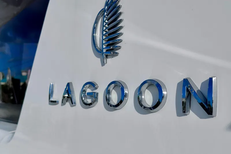  Yacht Photos Pics Chrome "Lagoon" logo on 2024 Lagoon 42 yacht exterior.