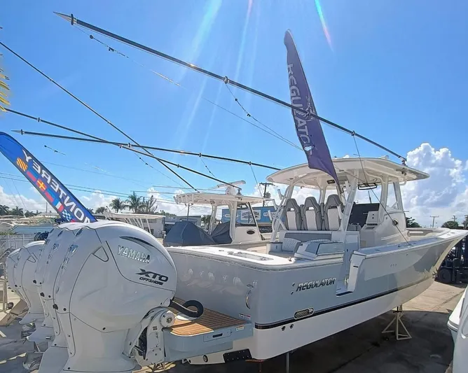  Yacht Photos Pics 2024 Regulator 37 boat with Yamaha XTO engines displayed under clear blue sky.