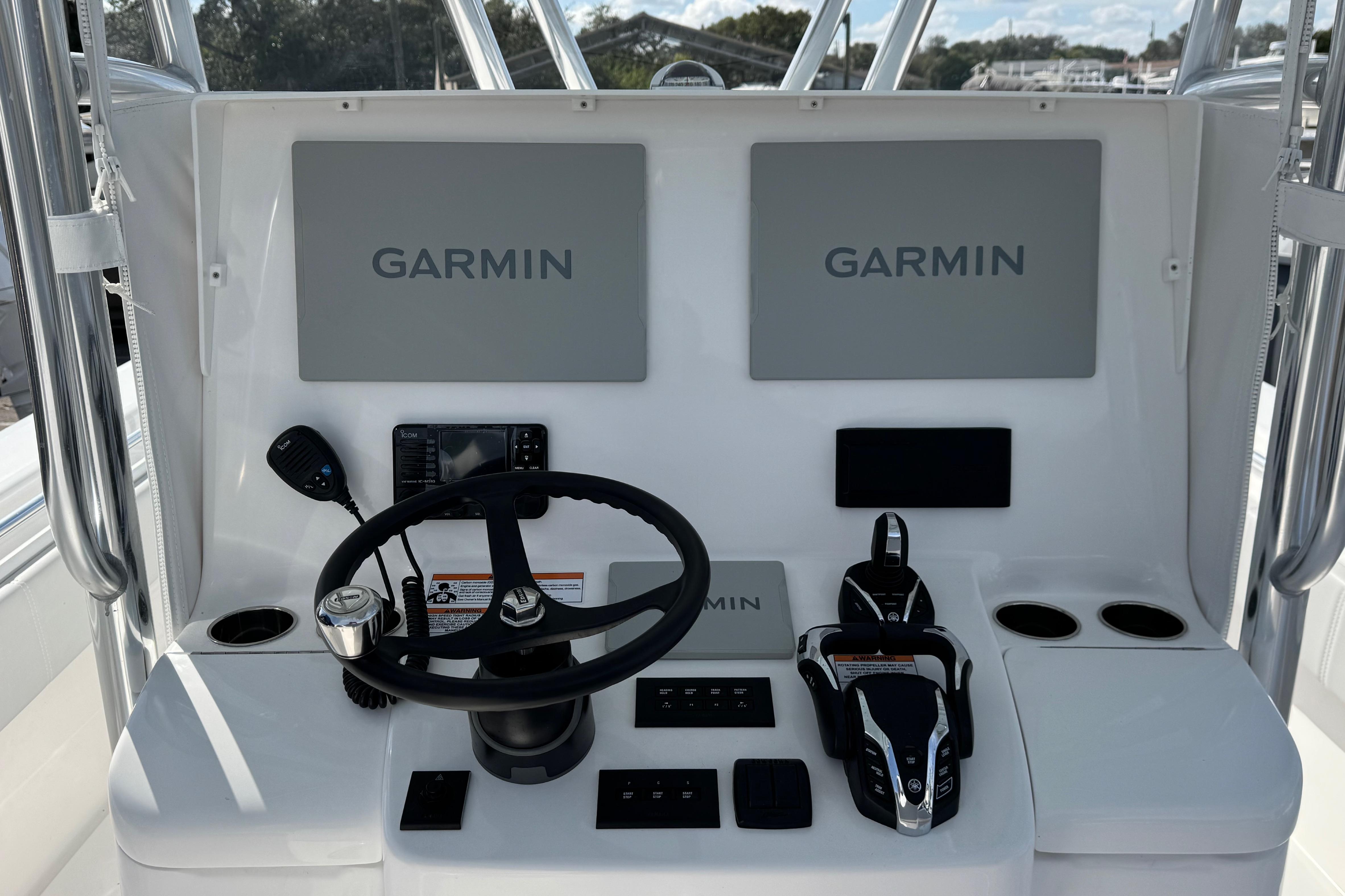 2026 Contender 35 ST boat dashboard with Garmin navigation displays and controls.