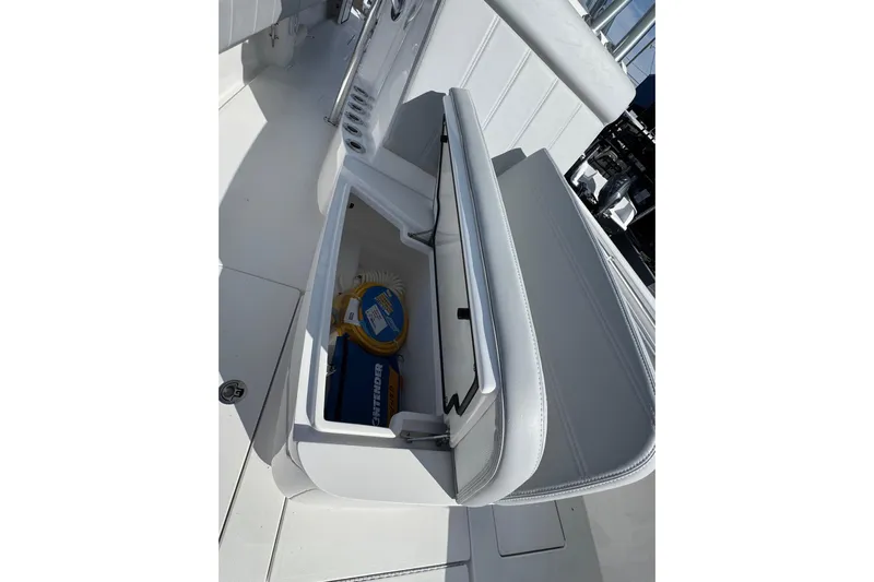  Yacht Photos Pics 2026 Contender 35 ST boat storage compartment with open lid, showcasing interior space.