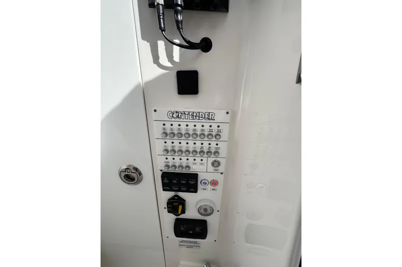  Yacht Photos Pics Control panel of 2026 Contender 35 ST boat with switches and dials.
