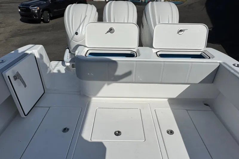  Yacht Photos Pics 2026 Contender 35 ST boat deck with storage compartments and outboard engines.