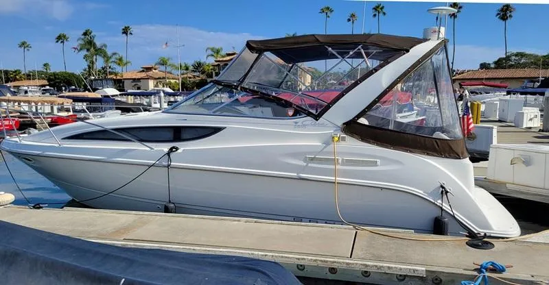 Hawley's Haven Yacht Photos Pics 2001 Bayliner 2855 Ciera docked at marina with clear skies and palm trees.