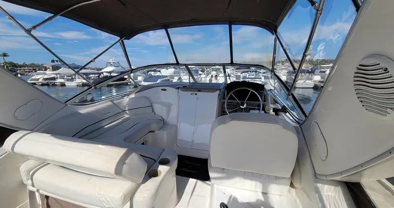 Hawley's Haven Yacht Photos Pics 2001 Bayliner 2855 Ciera boat interior with helm, seating, and marina view.