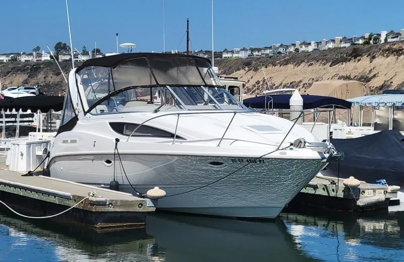 Hawley's Haven Yacht Photos Pics 2001 Bayliner 2855 Ciera docked at marina, clear sky, coastal background.