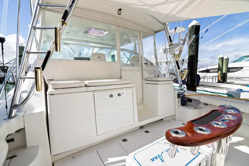 Lilli Ann Yacht Photos Pics 2001 Rampage 38 Express yacht interior with fishing rod holders and seating area.