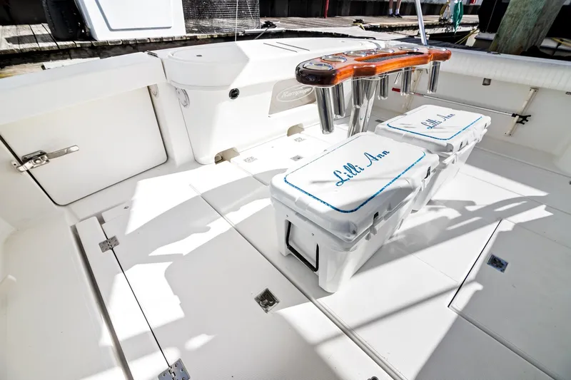 Lilli Ann Yacht Photos Pics 2001 Rampage 38 Express boat deck with storage and seating, featuring "Lilli Ann" branding.