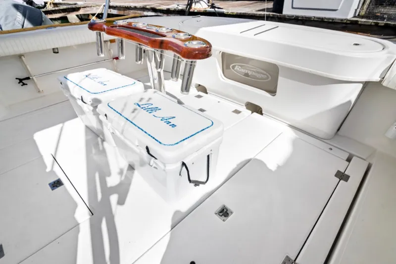 Lilli Ann Yacht Photos Pics 2001 Rampage 38 Express boat deck with fishing rod holders and storage compartments.
