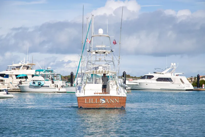 Lilli Ann Yacht Photos Pics 2001 Rampage 38 Express boat in marina, surrounded by other yachts.