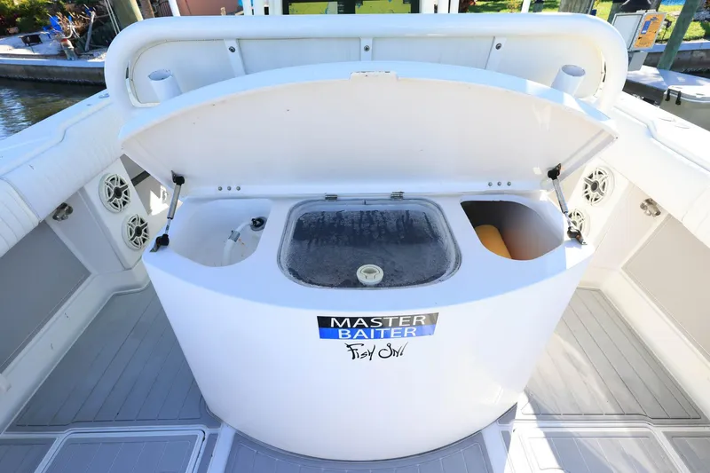  Yacht Photos Pics Open bait station on 2005 Jupiter 38 FS boat with "Master Baiter" sticker.