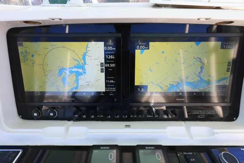  Yacht Photos Pics Dual Garmin displays on 2005 Jupiter 38 FS boat, showing navigational maps and data.