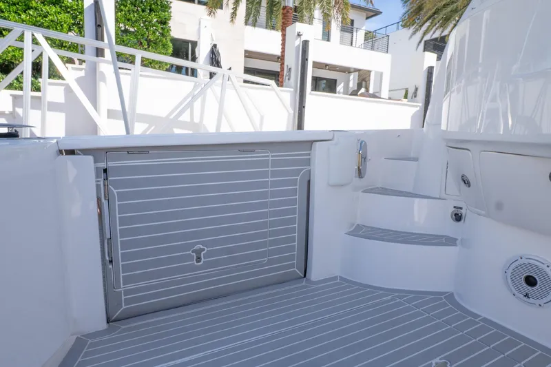 Garbonzo Yacht Photos Pics 2022 Intrepid 477 Evolution boat deck with sleek design and modern features.