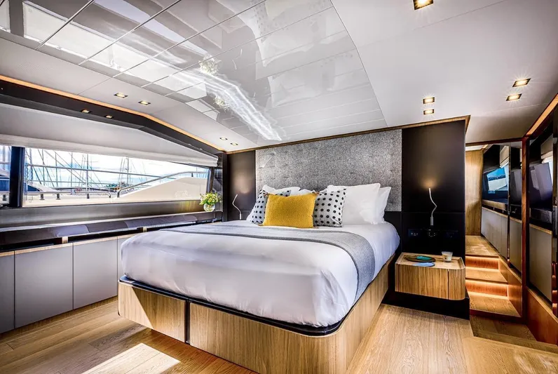  Yacht Photos Pics Luxurious bedroom interior of 2020 Ferretti Yachts 960 with modern design and elegant furnishings.