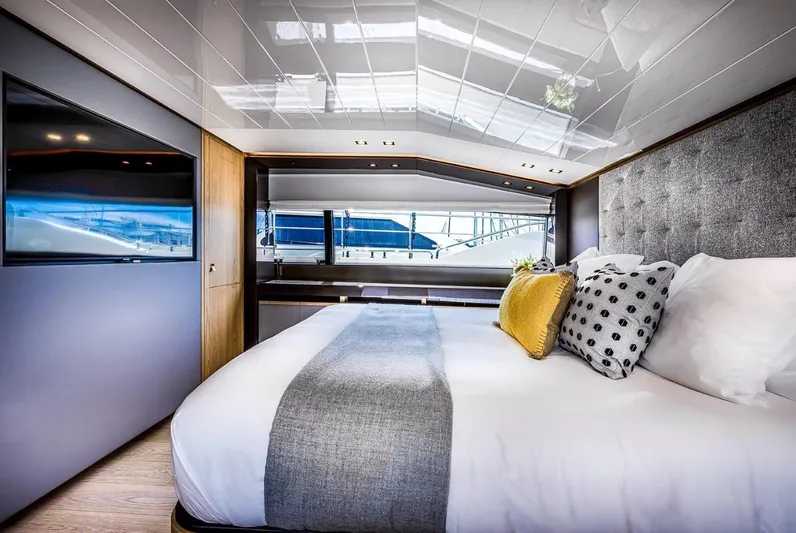  Yacht Photos Pics Luxurious bedroom interior of 2020 Ferretti Yachts 960 with modern design and elegant decor.