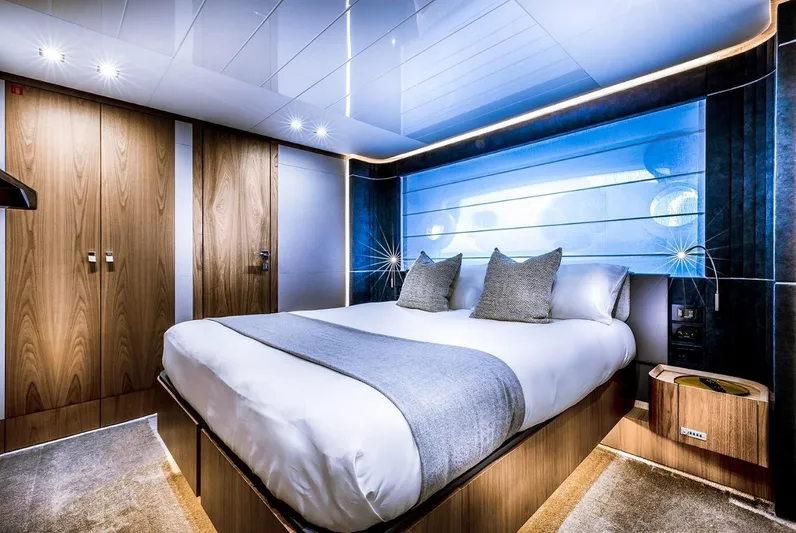 Yacht Photos Pics Luxurious bedroom interior of 2020 Ferretti Yachts 960 with modern design and ambient lighting.