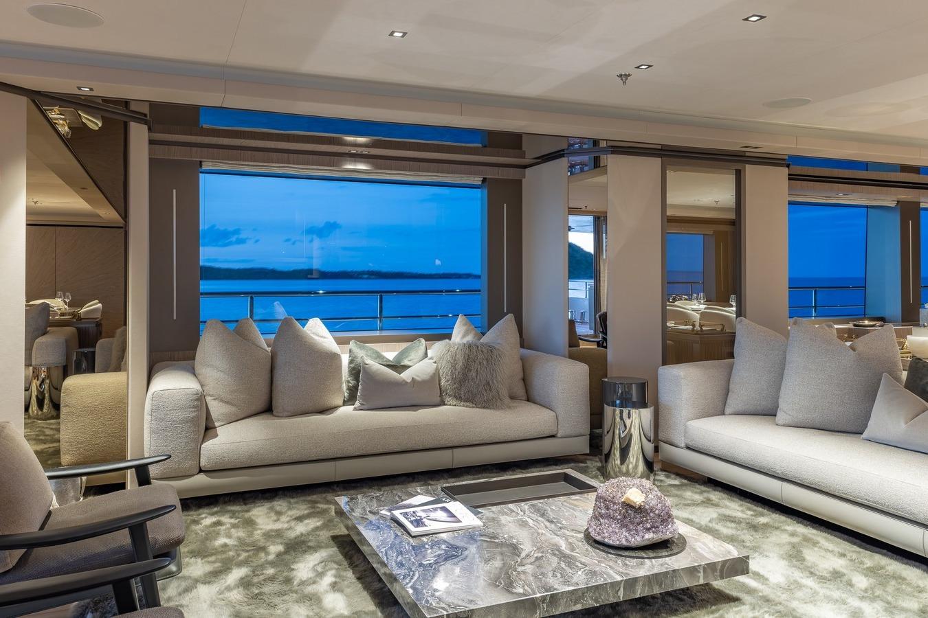 Luxurious interior of 2024 Codecasa 43 yacht with elegant sofas and ocean view.