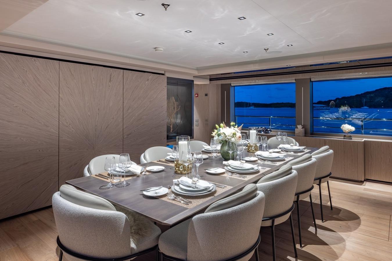 Luxurious dining area on 2024 Codecasa 43 yacht with elegant table setting and ocean view.