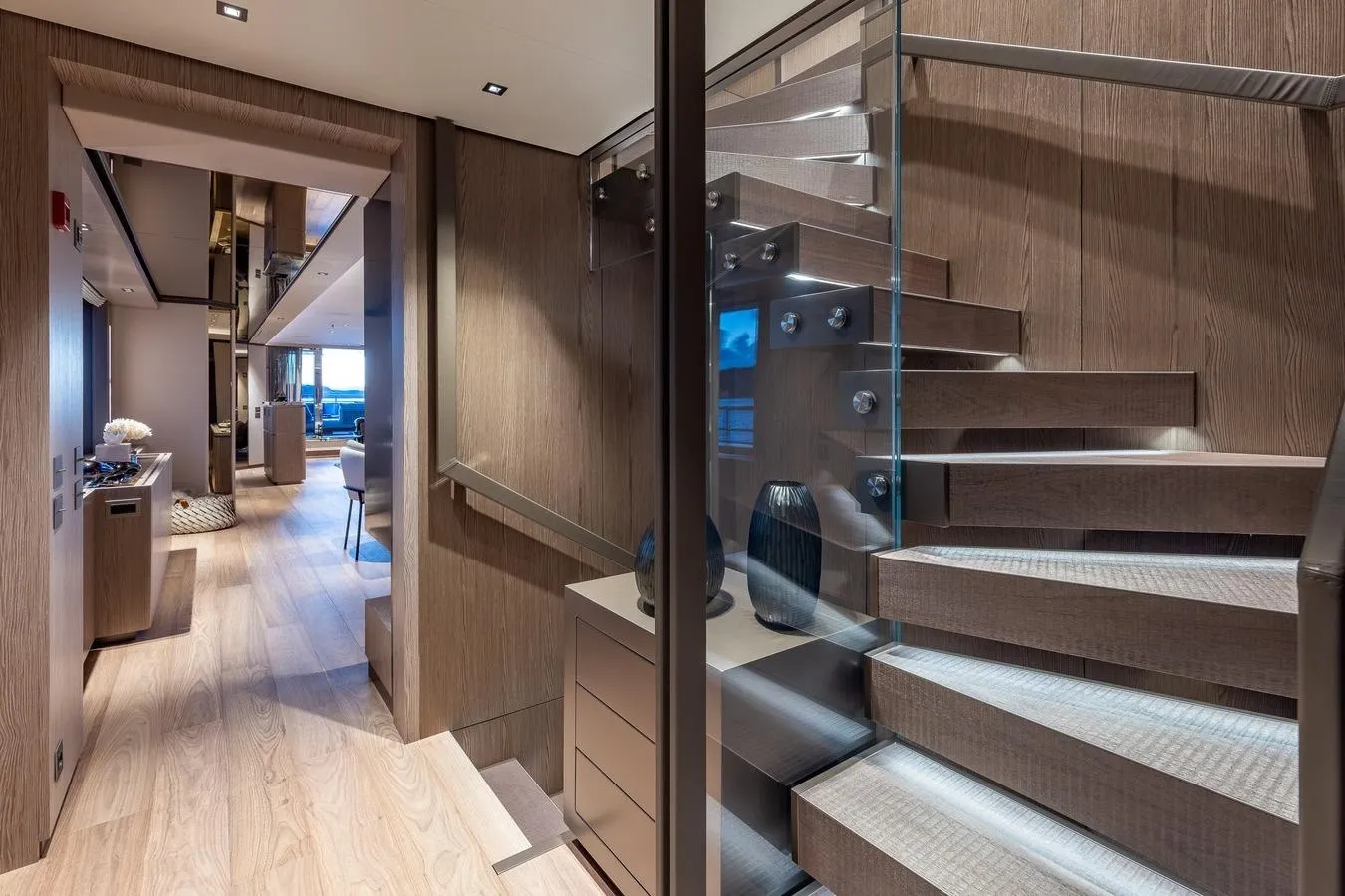 Luxurious interior of 2024 Codecasa 43 yacht with modern staircase and elegant decor.