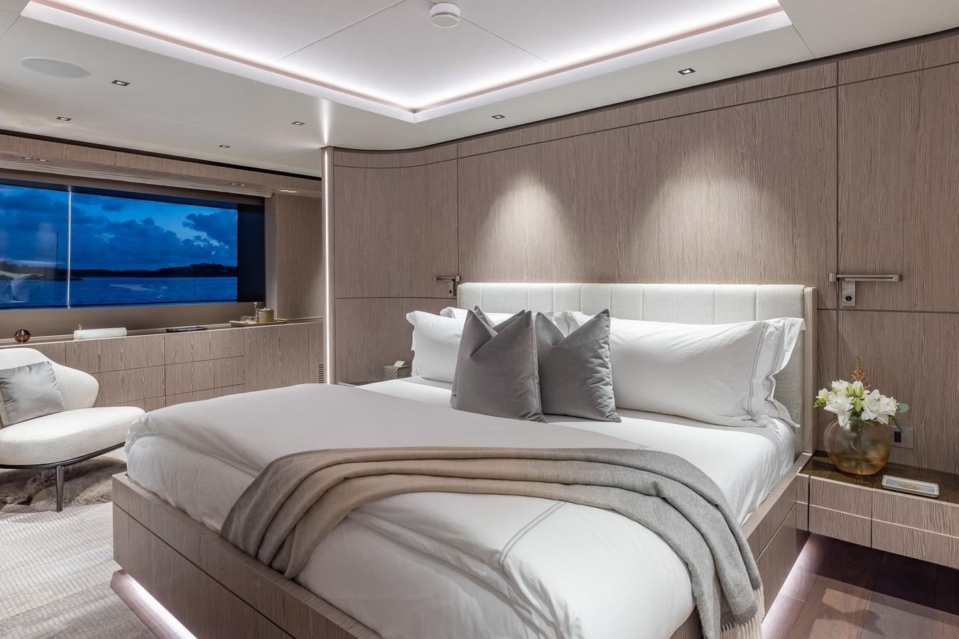 Luxurious bedroom interior on 2024 Codecasa 43 yacht, featuring elegant design and ocean view.