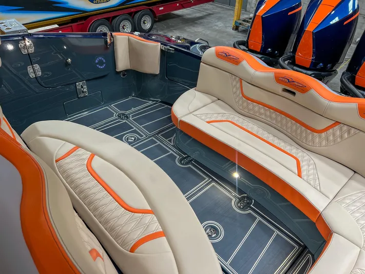 Thunder Struck Yacht Photos Pics Luxurious MTI V42 2024 boat interior with orange and beige seating.